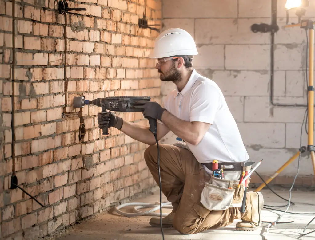 handyman uses jackhammer installation professional worker construction site concept electrician handyman